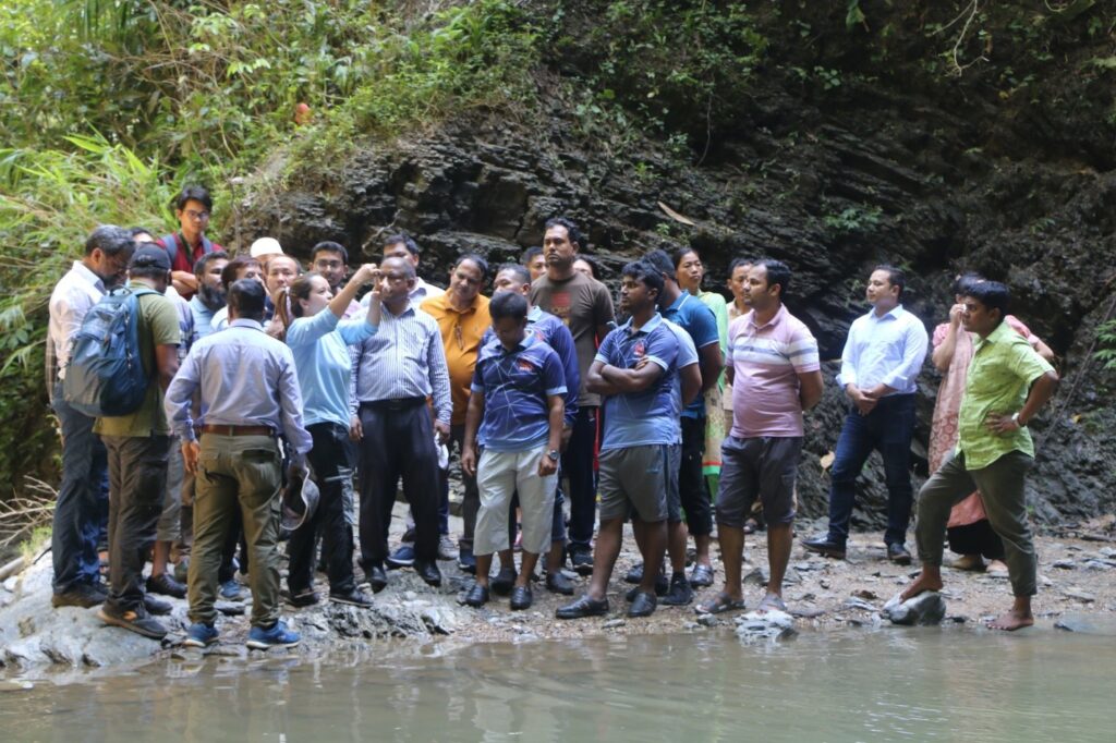 Participants gather by the spring site