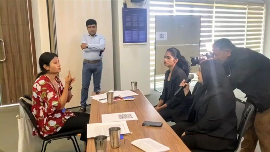 Participant Rabita Deula communicating her views via sign language during the workshop